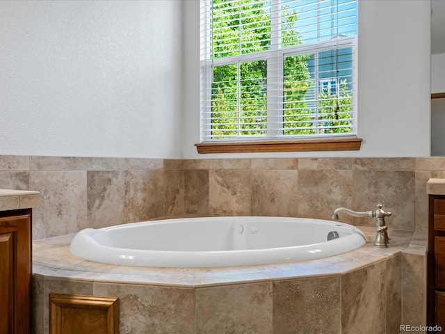 7254 S Kellerman Way, Aurora, CO 80016 - bathroom with vanity, a garden tub, and plenty of natural light