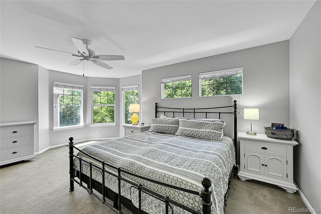 7064 E 2nd Ave, Denver, CO 80220 - carpeted bedroom with baseboards and a ceiling fan