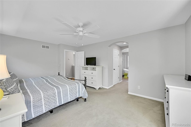 7064 E 2nd Ave, Denver, CO 80220 - bedroom featuring arched walkways, light colored carpet, baseboards, and ceiling fan