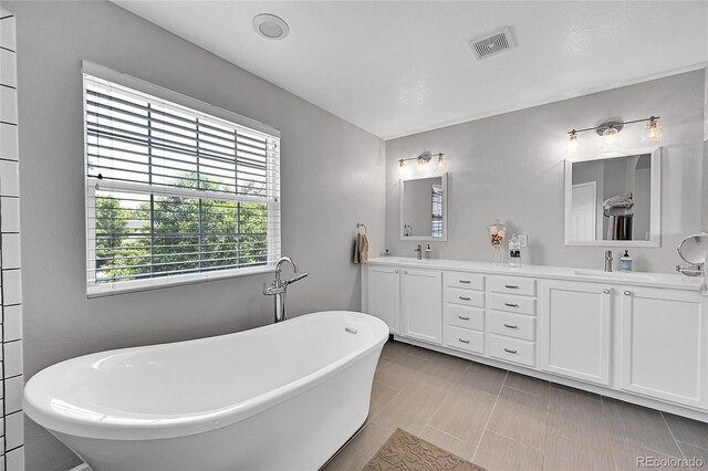 7064 E 2nd Ave, Denver, CO 80220 - full bath with double vanity and a freestanding tub