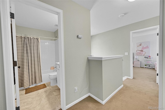 7064 E 2nd Ave, Denver, CO 80220 - hall featuring an upstairs landing, baseboards, and carpet flooring