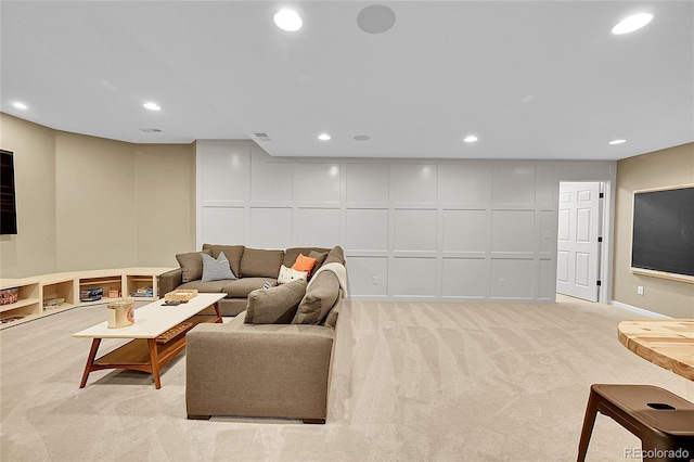 7064 E 2nd Ave, Denver, CO 80220 - living room with a decorative wall, light colored carpet, and recessed lighting