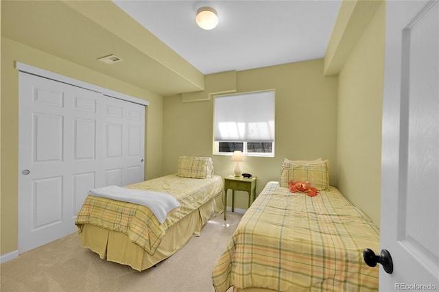7064 E 2nd Ave, Denver, CO 80220 - bedroom with light colored carpet and a closet