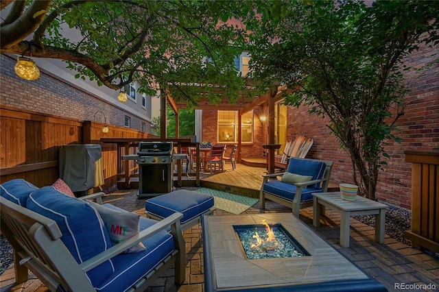7064 E 2nd Ave, Denver, CO 80220 - view of patio with an outdoor living space with a fire pit, grilling area, and a wooden deck
