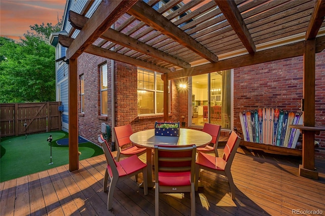 7064 E 2nd Ave, Denver, CO 80220 - wooden deck with a putting green, a pergola, and outdoor dining space