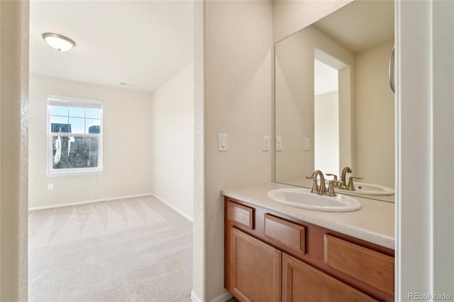 bathroom featuring vanity and baseboards