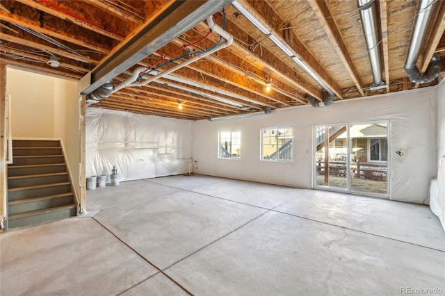 basement featuring stairs