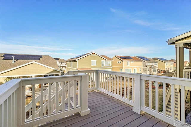 wooden deck featuring a residential view