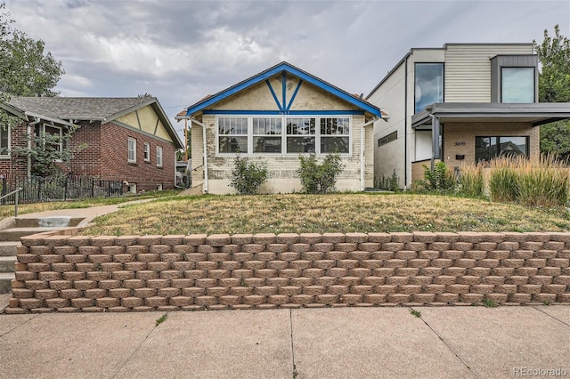 view of front facade with a front yard and a carport