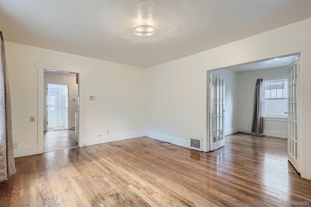 empty room featuring hardwood / wood-style flooring