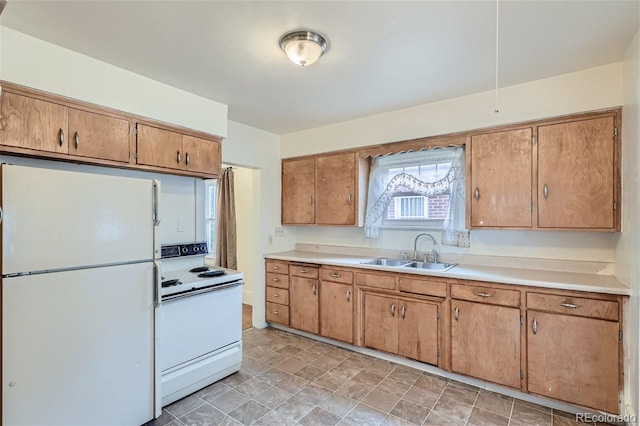 kitchen with sink and white appliances