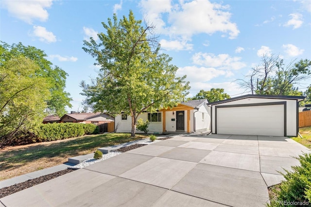 view of front facade with a garage and a front yard