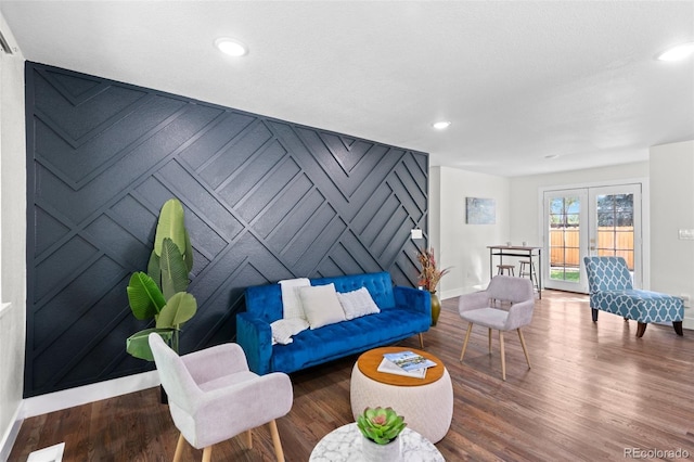 living room featuring wood-type flooring and french doors