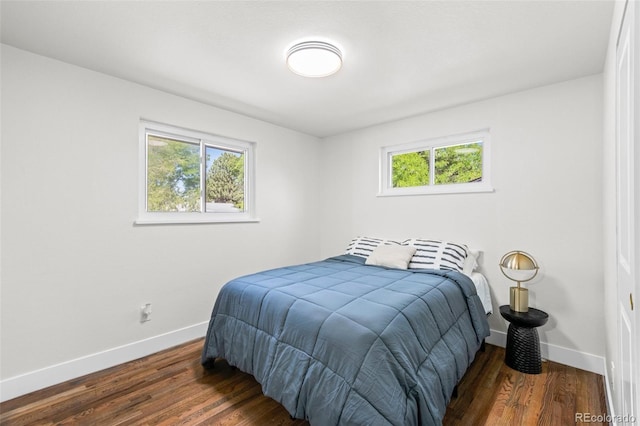 bedroom featuring dark hardwood / wood-style flooring