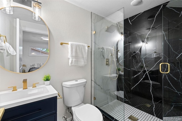 bathroom featuring a shower with door, vanity, a textured ceiling, and toilet