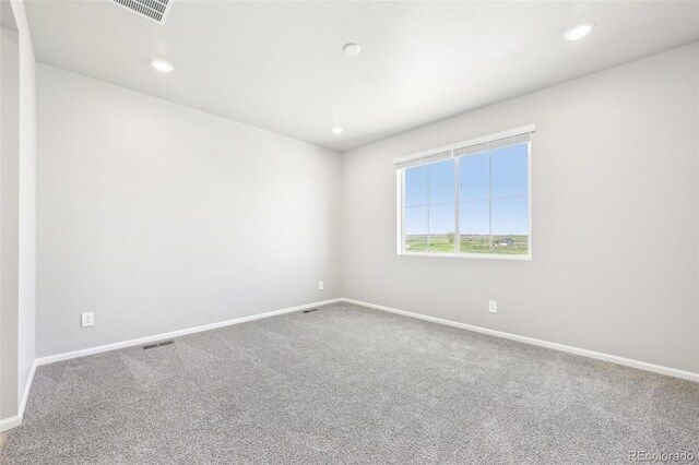 1957 S Coolidge Way, Aurora, CO 80018 - unfurnished room featuring baseboards, carpet floors, and recessed lighting