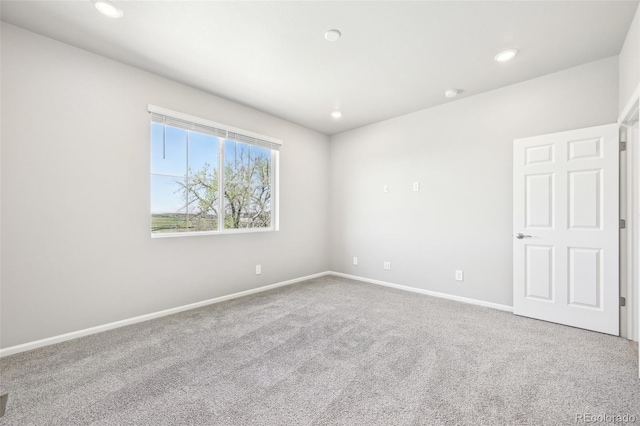1957 S Coolidge Way, Aurora, CO 80018 - unfurnished room featuring carpet, baseboards, recessed lighting, and a smoke detector