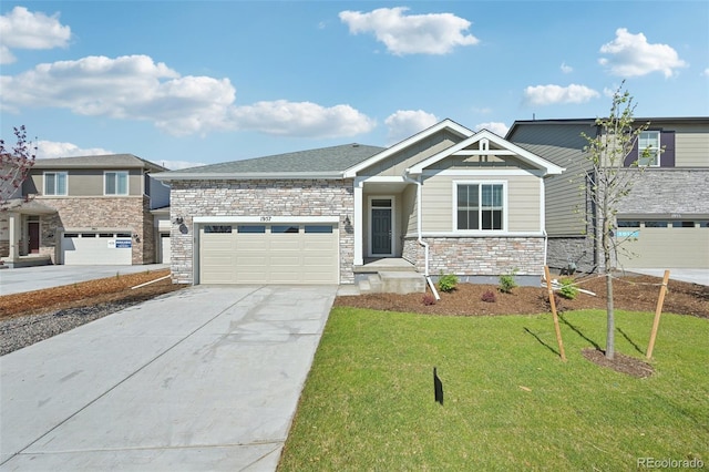 1957 S Coolidge Way, Aurora, CO 80018 - view of front facade featuring concrete driveway, a front lawn, stone siding, and a garage