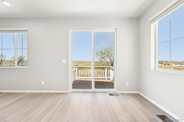 1957 S Coolidge Way, Aurora, CO 80018 - spare room with wood finished floors and baseboards