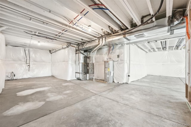 1957 S Coolidge Way, Aurora, CO 80018 - garage featuring electric water heater and heating unit