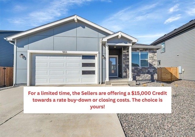 503 Bobcat Ct, Wiggins, CO 80654 - single story home with stone siding, driveway, and an attached garage