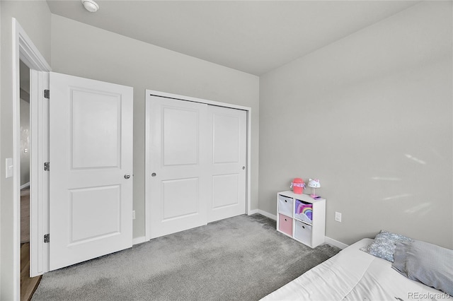 503 Bobcat Ct, Wiggins, CO 80654 - bedroom with carpet floors, baseboards, and a closet