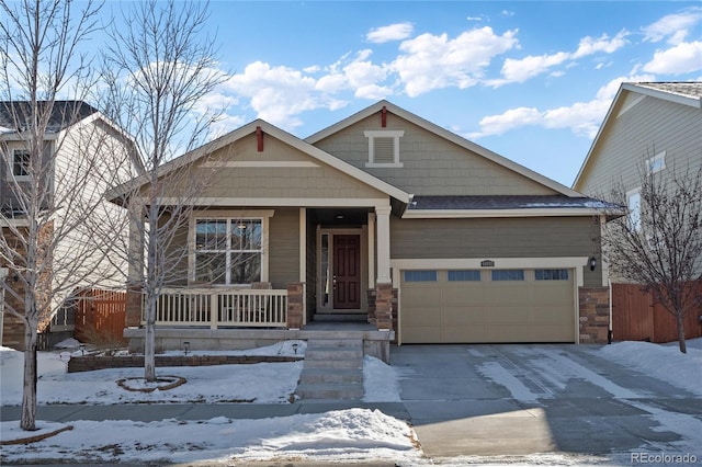 view of front of house featuring a garage and covered porch