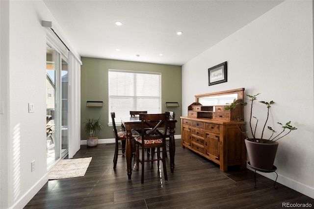 dining space with dark hardwood / wood-style floors