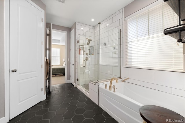 bathroom with plus walk in shower and tile patterned flooring