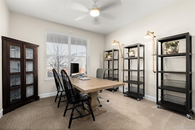 carpeted office with ceiling fan