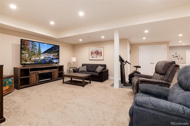 carpeted living room featuring a fireplace