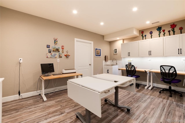 rec room with light hardwood / wood-style floors