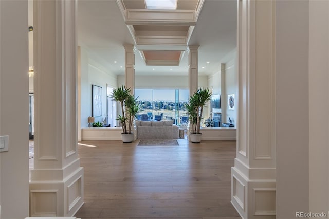 foyer with recessed lighting, decorative columns, and wood finished floors