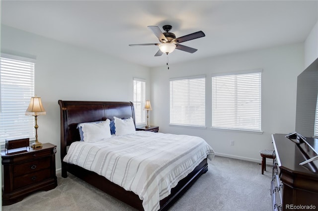 bedroom with ceiling fan and light colored carpet