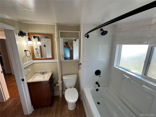 bathroom featuring shower / bath combination, vanity, toilet, and wood finished floors