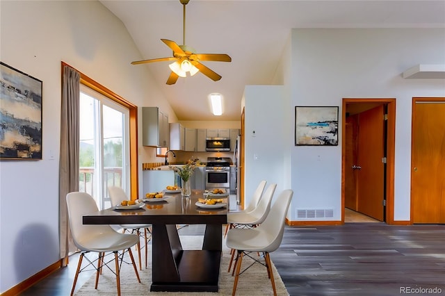 dining room with visible vents, baseboards, high vaulted ceiling, a ceiling fan, and dark wood-style flooring