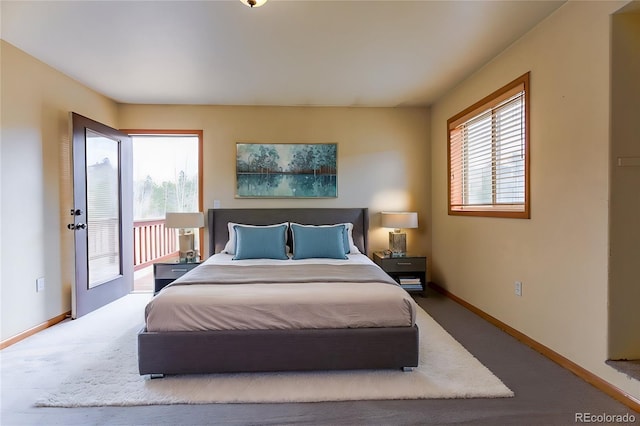 bedroom with baseboards, carpet floors, and access to outside