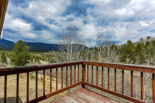 wooden terrace with a mountain view