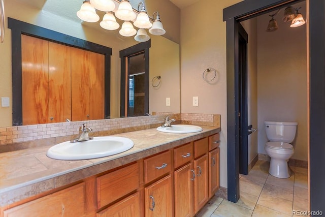 full bathroom with tile patterned flooring, double vanity, tasteful backsplash, and a sink