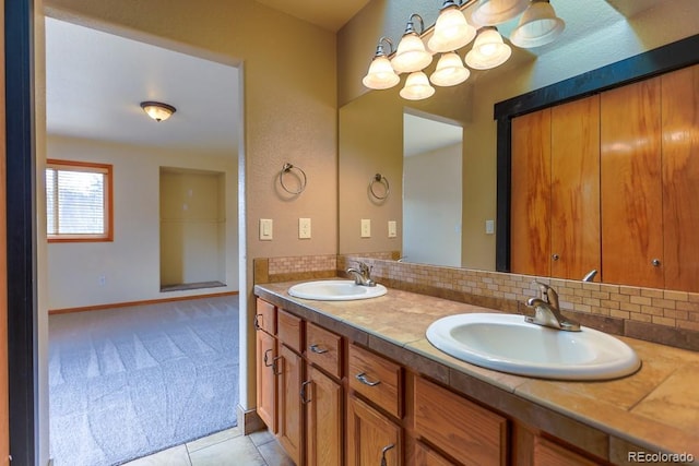 full bathroom with double vanity, decorative backsplash, and a sink