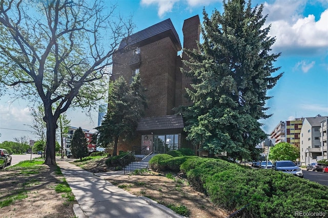 view of front of house featuring a chimney