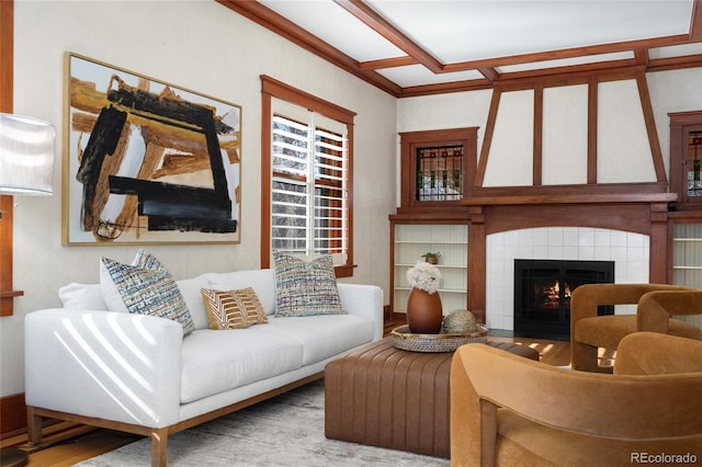 living room with a tile fireplace