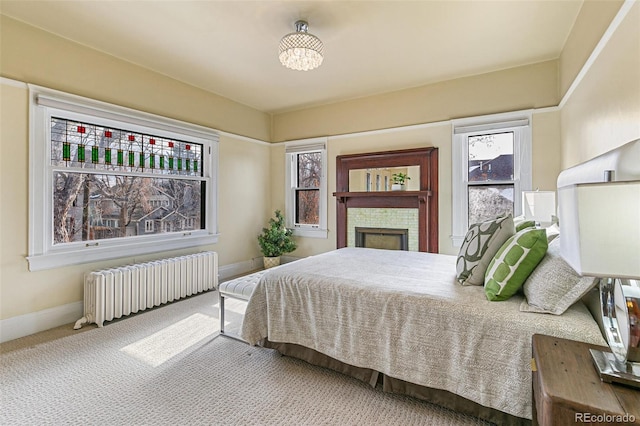 bedroom featuring radiator and carpet flooring