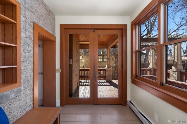 doorway to outside with a baseboard radiator and french doors