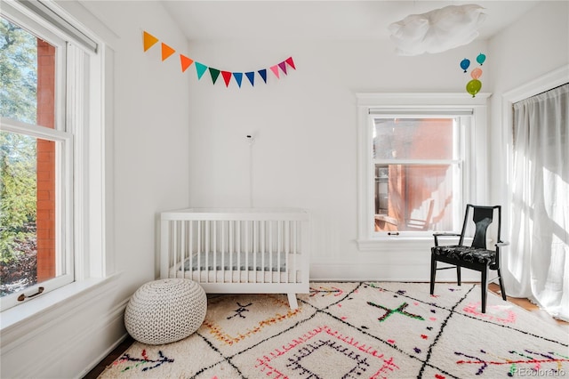 bedroom featuring a crib