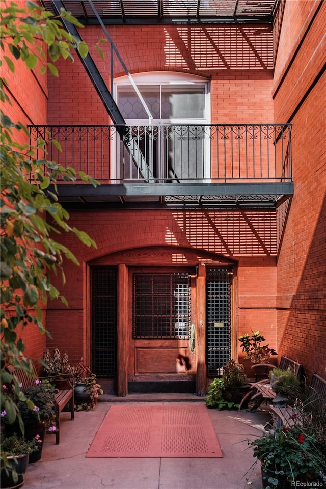 property entrance with a balcony