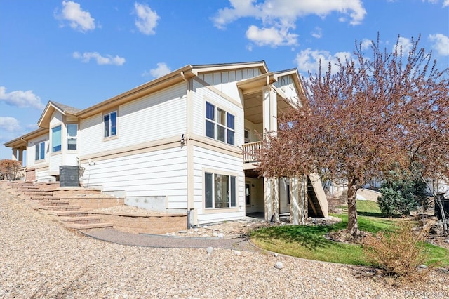 8714 E 148th Cir, Thornton, CO 80602 - view of property exterior with board and batten siding and stairway