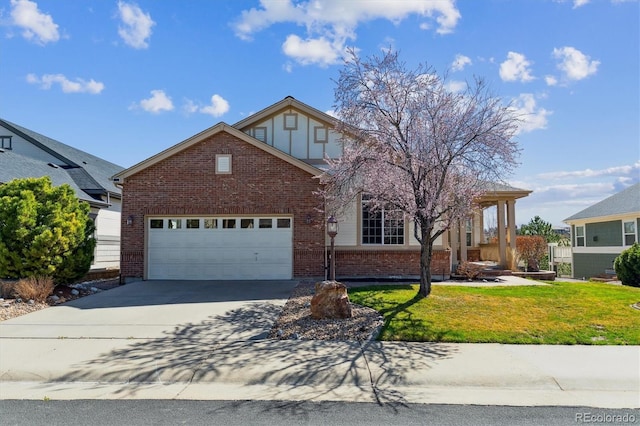 8714 E 148th Cir, Thornton, CO 80602 - view of front of property featuring an attached garage, driveway, a front yard, and brick siding