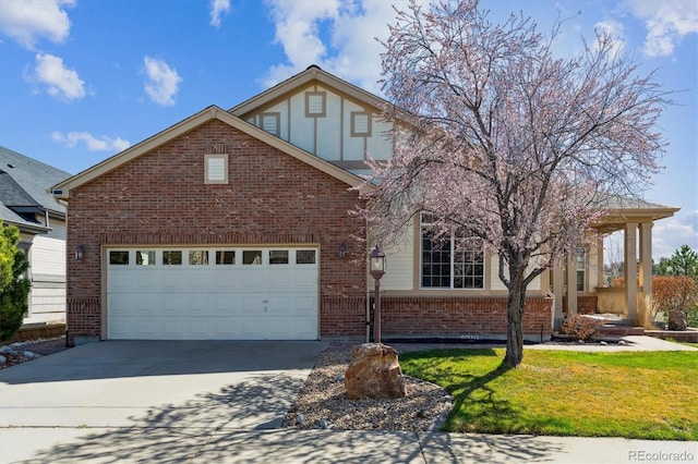 8714 E 148th Cir, Thornton, CO 80602 - view of front of home with board and batten siding, a garage, a front yard, brick siding, and concrete driveway