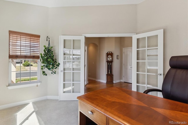 8714 E 148th Cir, Thornton, CO 80602 - carpeted home office featuring french doors, baseboards, and arched walkways